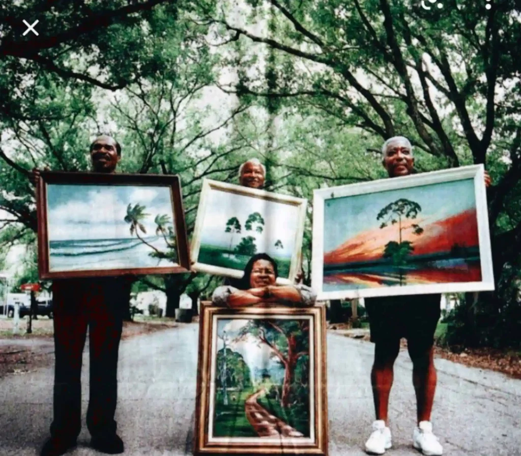 Highwaymen Willie Reagan, Lemuel Newton, Rodney Demps and Mary Ann Carroll show off their paintings